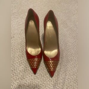 Stuart Weitzman pointy closed toe pumps with gold studs patent leather